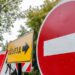 The signs forbidding movement directly and reporting about the direction of a detour